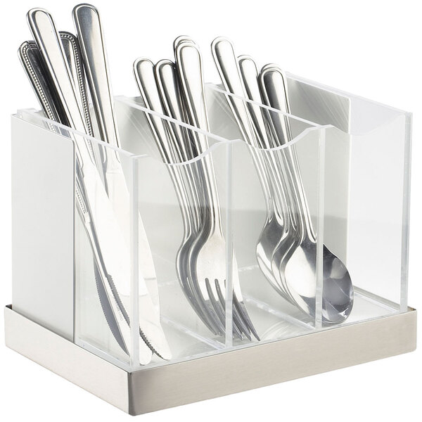 A white metal Cal-Mil flatware organizer with silverware inside.