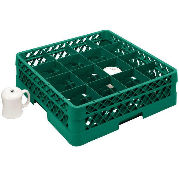A green plastic Vollrath cup rack with 16 compartments holding white cups.