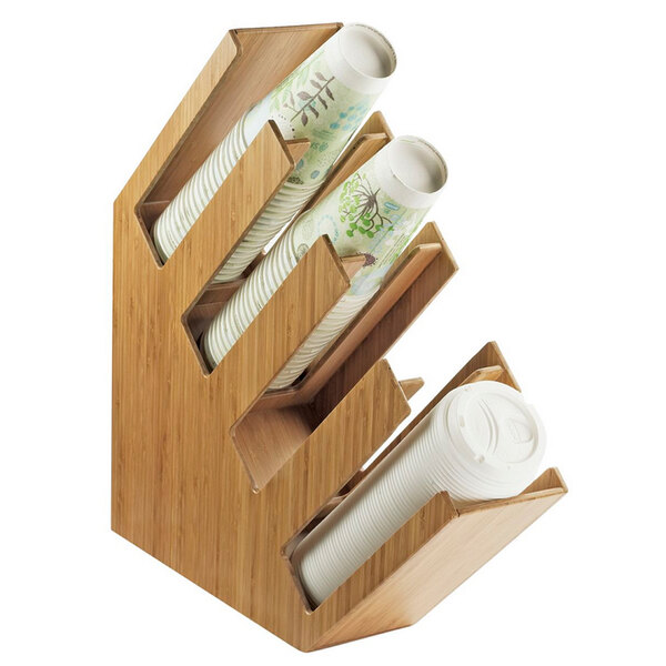 A Cal-Mil bamboo countertop cup and lid organizer with white cups in it.