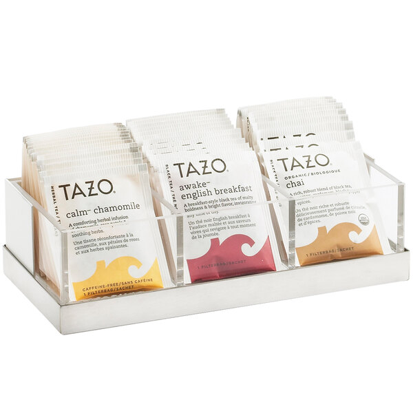 A Cal-Mil Luxe stainless steel condiment organizer holding Tazo tea packets.