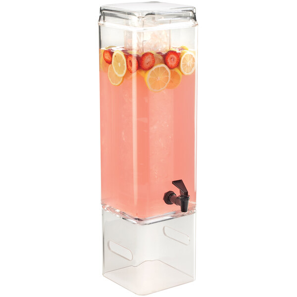 A clear plastic Cal-Mil beverage dispenser with fruit and lemon slices.
