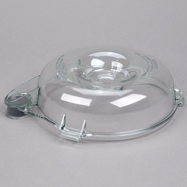 A clear plastic lid with a hole for a Robot Coupe commercial food processor.