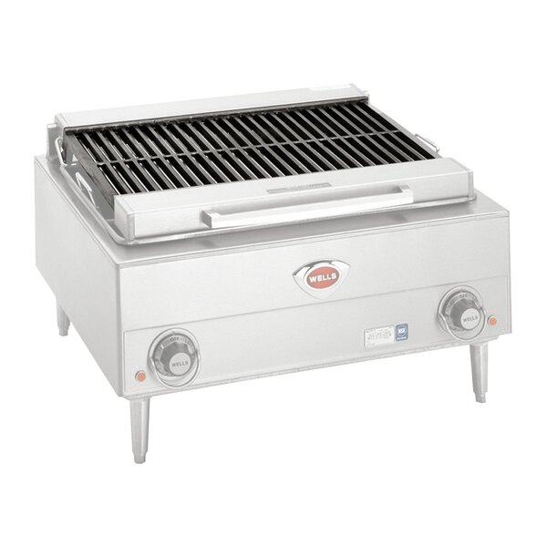 A stainless steel Wells charbroiler grate on a grill.
