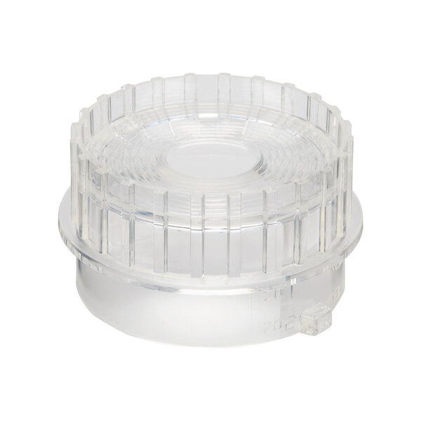 A clear plastic round lid with a small hole in it.