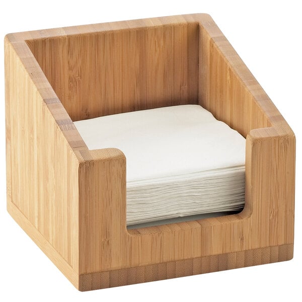 A Cal-Mil bamboo napkin holder with napkins inside.