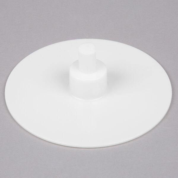 A white plastic Robot Coupe discharge plate.