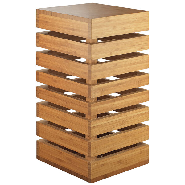 A Cal-Mil bamboo square crate riser with multiple layers of shelves.