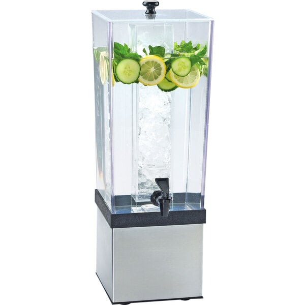 A Cal-Mil plastic beverage dispenser with ice and fruits.