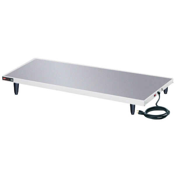 A white rectangular Hatco heated shelf table with a power cord.