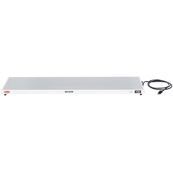 A white rectangular Hatco heated shelf with black wires.
