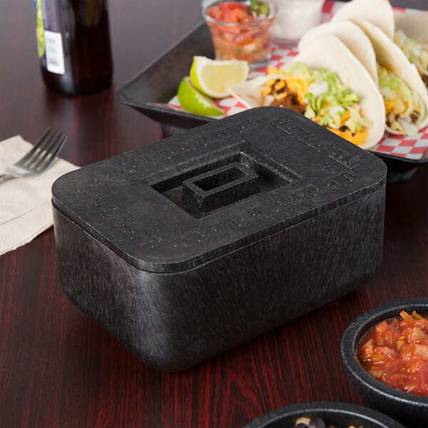 A black HS Inc. multi-purpose container with a square lid on a table with tacos.