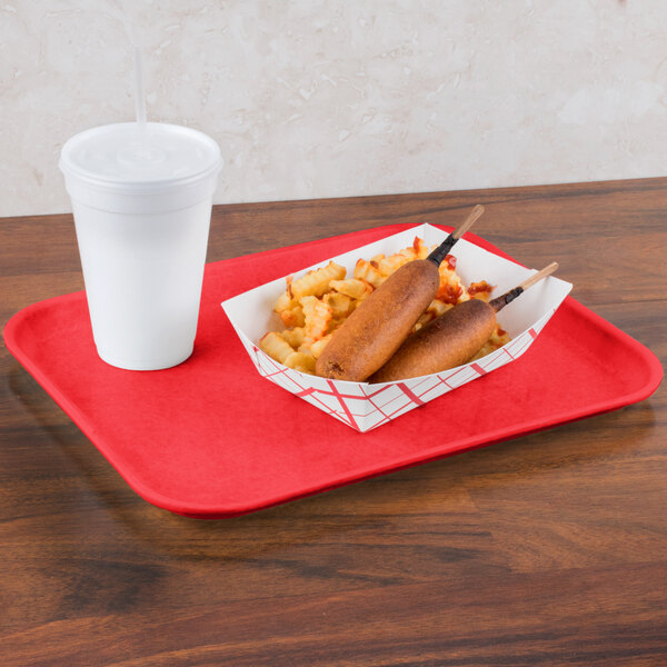 A Carlisle red Glasteel tray with food and a drink on it.