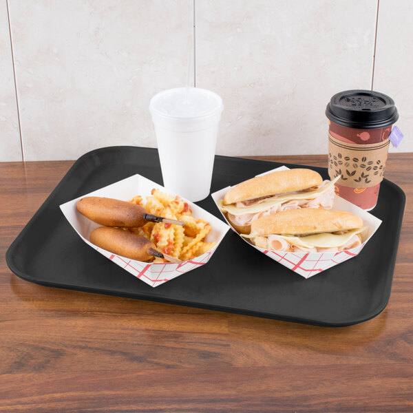 A Carlisle black Glasteel tray with a hot dog and a coffee on it.