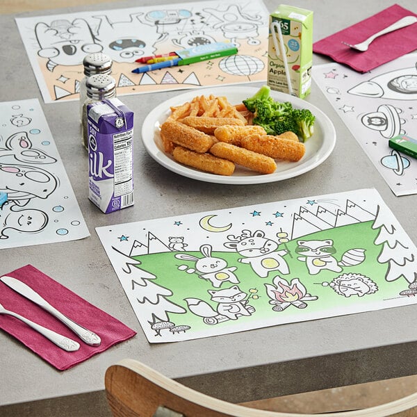 A table with a Hoffmaster kids interactive placemat and a plate of food with a drawing on it.