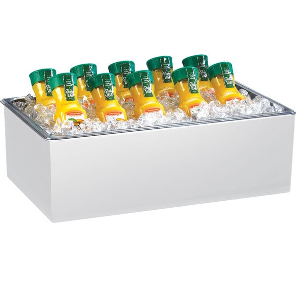 A white melamine ice housing container filled with clear liquid and a yellow bottle on a table.