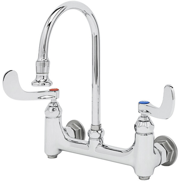 A silver T&S wall mounted surgical sink faucet with 4" wrist action handles.