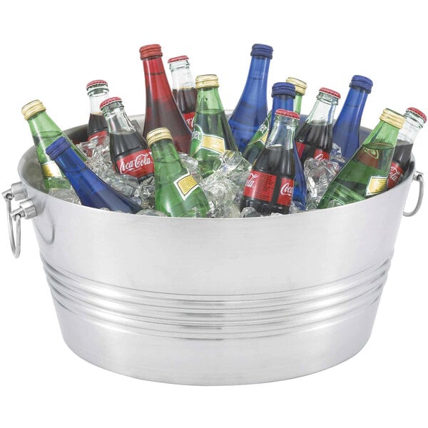 A Vollrath conical metal beverage tub filled with soda bottles.