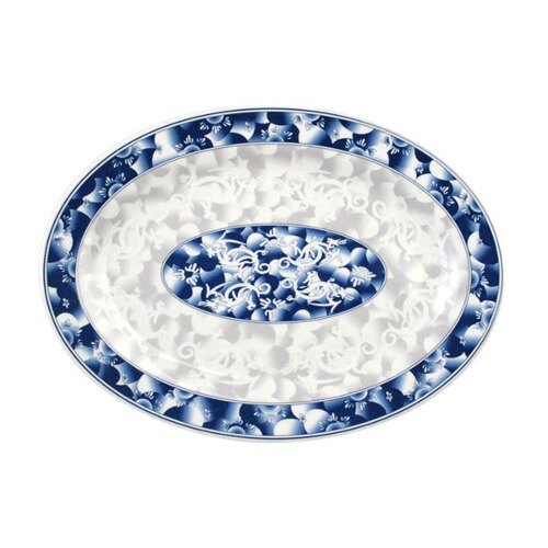 A white oval melamine platter with a blue and white dragon pattern.