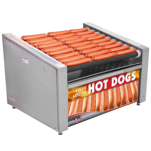 An APW Wyott hot dog roller with hot dogs cooking