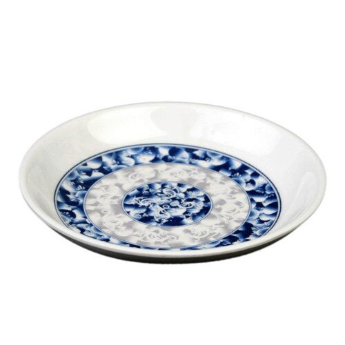 A close-up of a Thunder Group Blue Dragon sauce dish with a blue and white floral design.