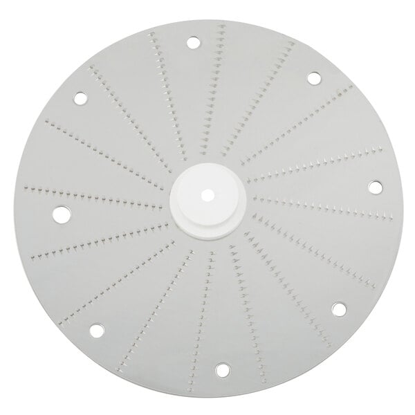 A white circular Robot Coupe pulping disc with holes in it.