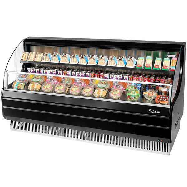 A black Turbo Air low profile horizontal air curtain display case on a deli counter with food in it.