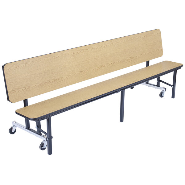 A National Public Seating wooden bench with black metal legs and wheels.