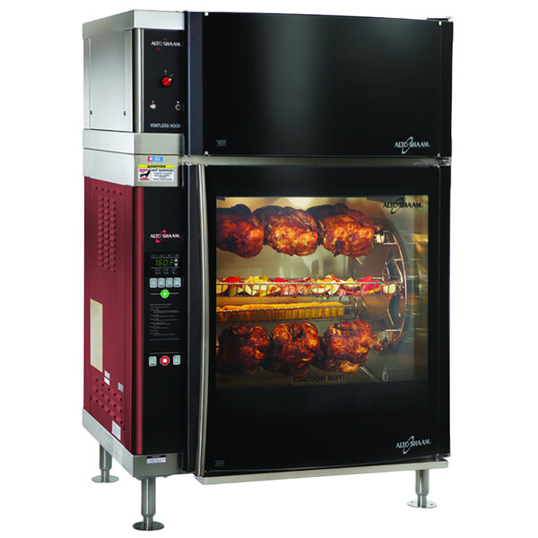 An Alto-Shaam double pane curved glass rotisserie oven with 7 spits and meat cooking inside.