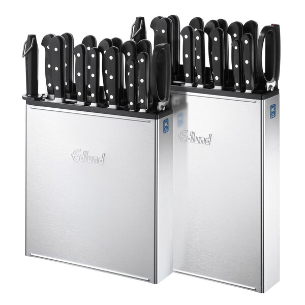 A group of knives in an Edlund stainless steel knife rack.