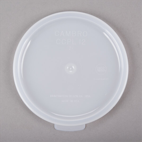 A white plastic lid for a Cambro clear crock with white text.
