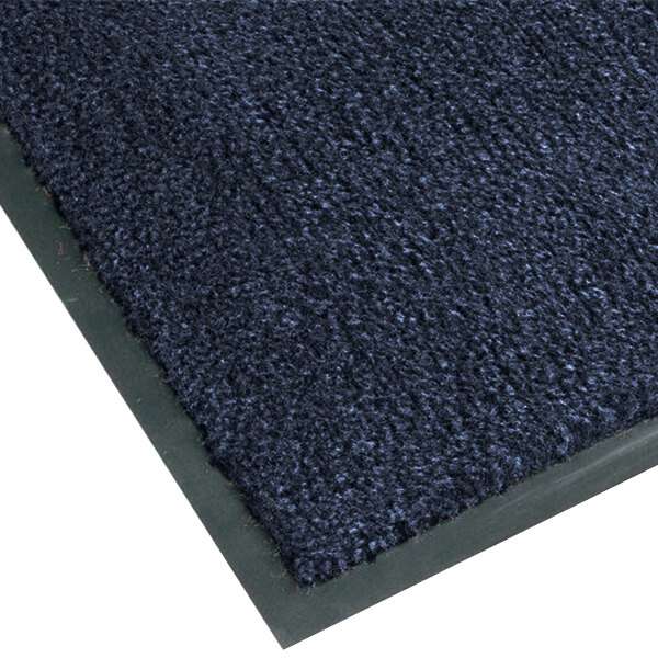 A slate blue carpet entrance mat with a black border.