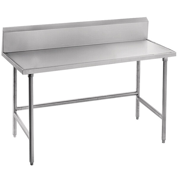 A stainless steel Advance Tabco work table with an open base and a backsplash.