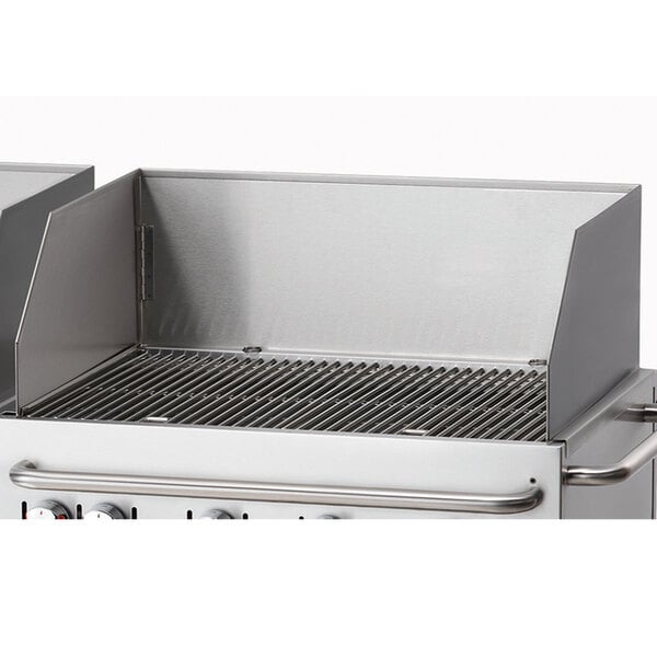 A Crown Verity stainless steel wind guard on a grill.