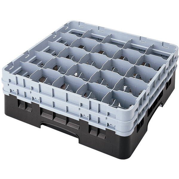 A black plastic Cambro glass rack with many compartments and extenders.