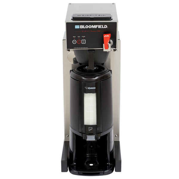 A black Bloomfield automatic thermal coffee brewer with a silver base and white touchpad controls.