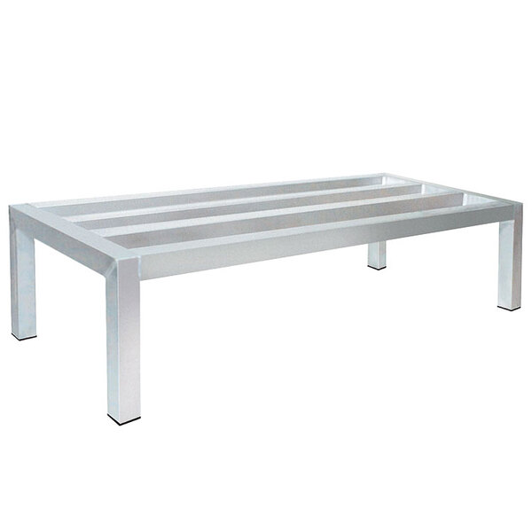 An Advance Tabco aluminum dunnage rack with metal legs.