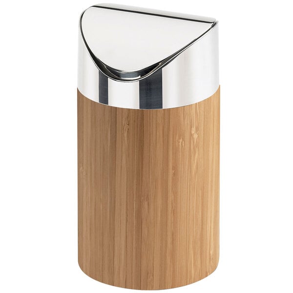 A Cal-Mil round counter trash bin with a bamboo lid and silver metal accents.