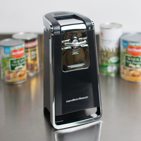 A black and silver Hamilton Beach SmoothTouch Electric Can Opener on a counter.