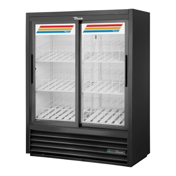 A black True convenience store merchandiser glass door refrigerator with sliding doors.