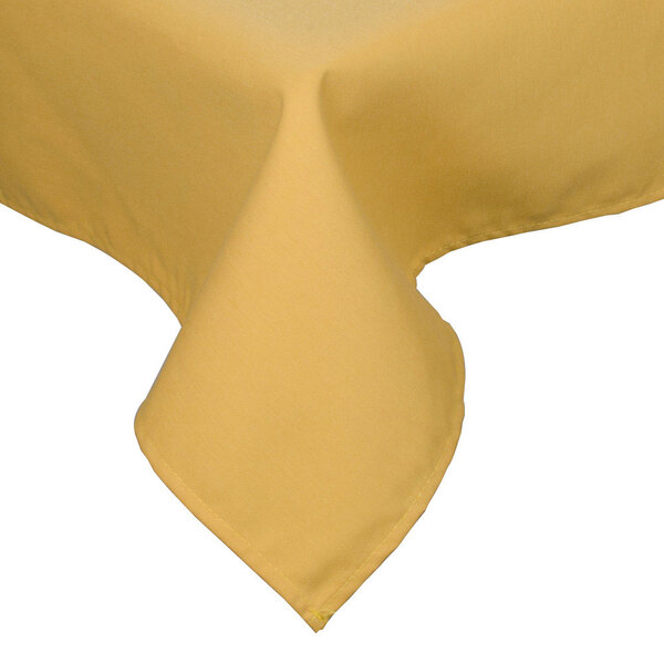 A yellow Intedge rectangular table cover with a hemmed edge on a table.