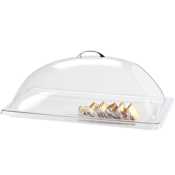 A Cal-Mil clear plastic dome cover with food inside.