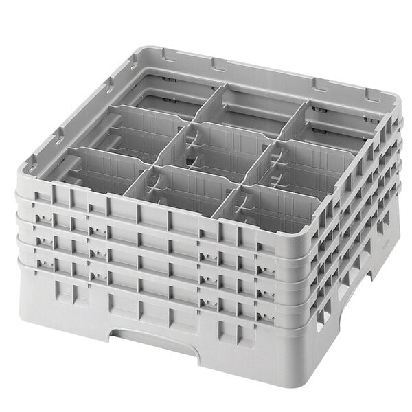 A white plastic Cambro glass rack with 9 compartments.
