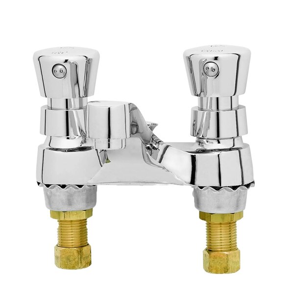 A T&S deck mounted metering faucet with two brass handles.