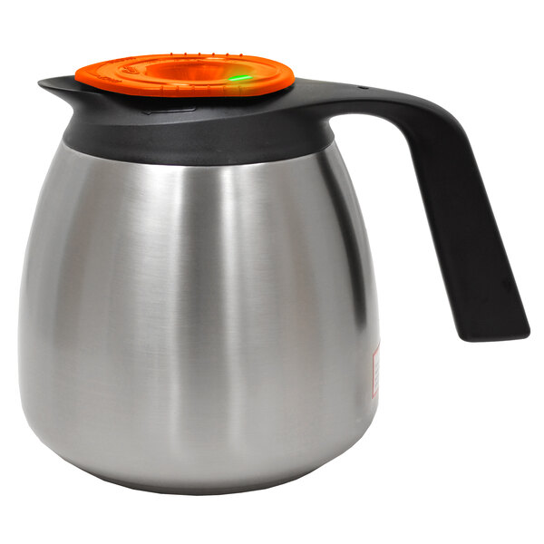 A silver stainless steel Curtis FreshTrac coffee decanter with a black and orange lid.