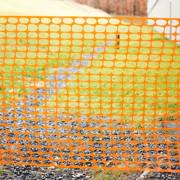 A roll of orange Cordova Safety Fencing with an oval pattern.