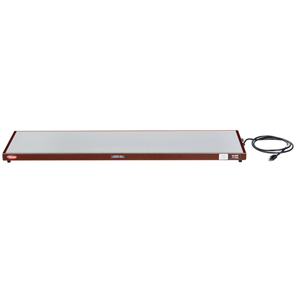 A white rectangular Hatco heated shelf with a black cord.