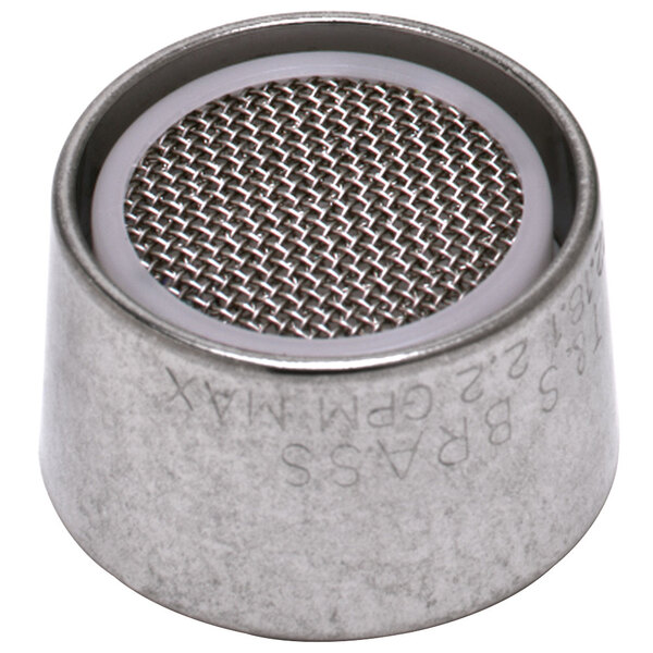 A close-up of a metal round object with a mesh pattern.