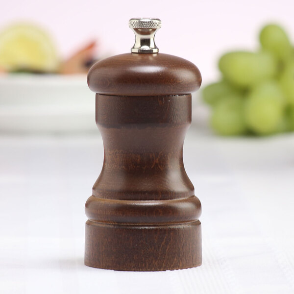 A Chef Specialties Capstan Walnut Salt Mill with a wooden handle.