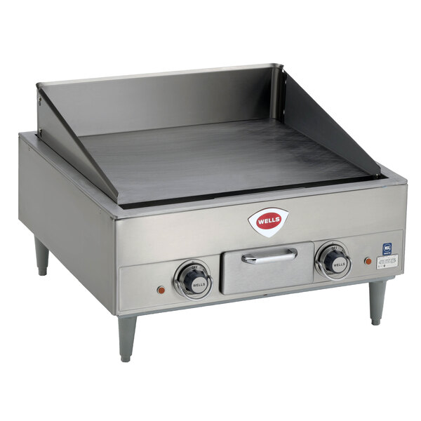 A Wells countertop electric griddle with two burners.