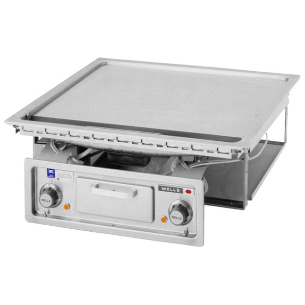 A Wells 24" drop-in electric countertop griddle on a counter.